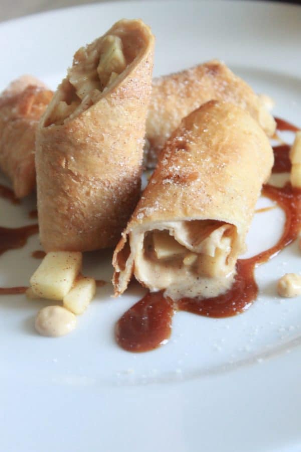 Salted Caramel Apple Chimichangas prepared with Salted Caramel, Sweetened Cream, and Cinnamon Sugar Apples wrapped in a Tortilla and Fried till golden.