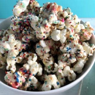 This Birthday Cake Popcorn is so addicting made with real ingredients! This popcorn has all the flavors of birthday cake but with no boxed processed mixes!!